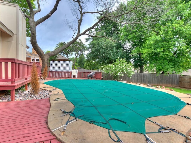 904 Carfax Rd, Edmond, OK 73034 - view of swimming pool featuring a deck and a fenced backyard