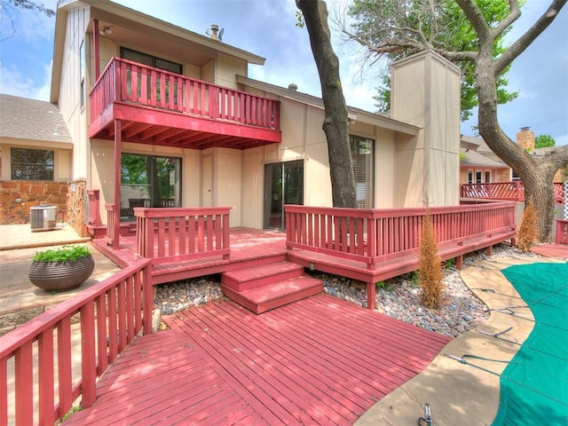 904 Carfax Rd, Edmond, OK 73034 - wooden terrace featuring a patio area