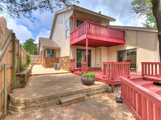 904 Carfax Rd, Edmond, OK 73034 - rear view of house with a balcony, a fenced backyard, and a patio area