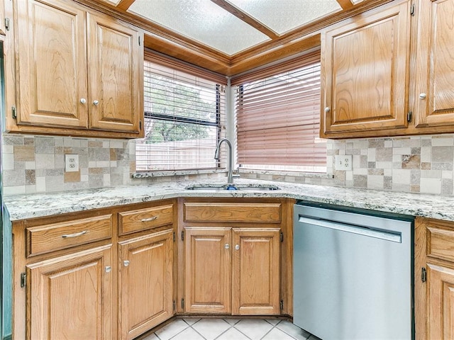 904 Carfax Rd, Edmond, OK 73034 - kitchen with stainless steel dishwasher, decorative backsplash, light stone counters, and light tile patterned floors