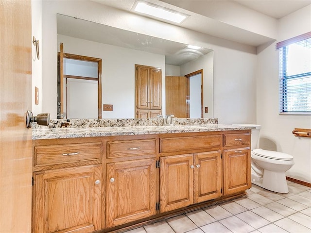 904 Carfax Rd, Edmond, OK 73034 - bathroom featuring double vanity and tile patterned floors