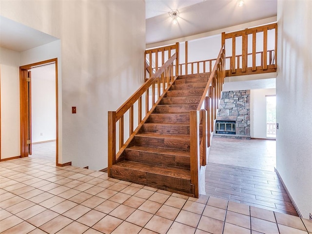 904 Carfax Rd, Edmond, OK 73034 - stairway with baseboards and a stone fireplace