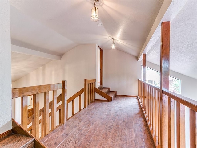 904 Carfax Rd, Edmond, OK 73034 - corridor featuring wood-type flooring and vaulted ceiling