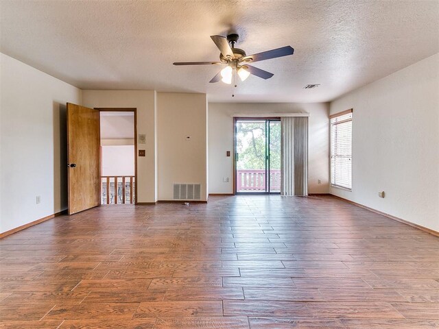 904 Carfax Rd, Edmond, OK 73034 - unfurnished room featuring wood finished floors, ceiling fan, and a textured ceiling