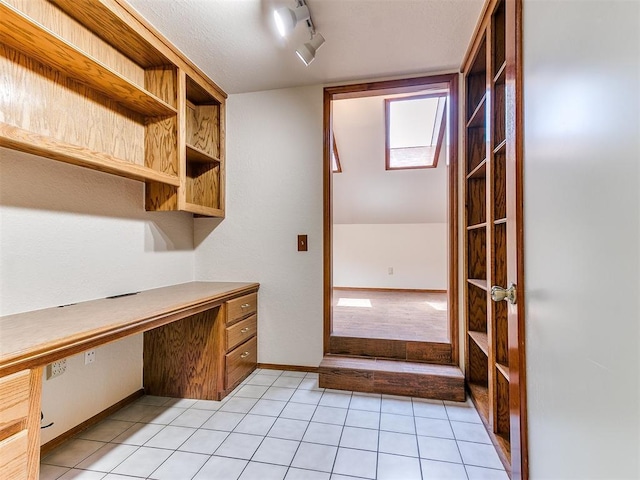 904 Carfax Rd, Edmond, OK 73034 - unfurnished office featuring built in study area and light tile patterned flooring