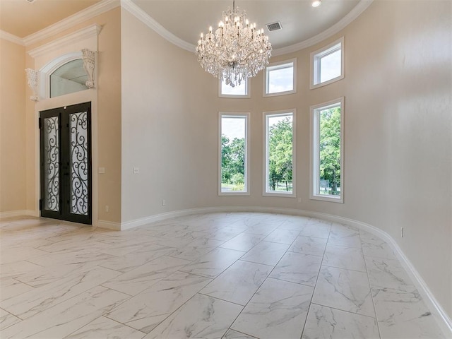 6209 Lakewood Ridge Rd, Edmond, OK 73013 - unfurnished room with light marble finish flooring, a chandelier, crown molding, and a towering ceiling