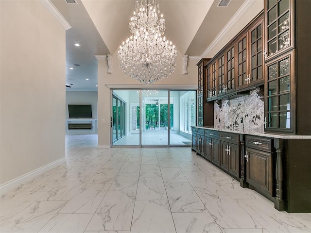 6209 Lakewood Ridge Rd, Edmond, OK 73013 - bar with crown molding, a chandelier, light marble finish flooring, a high ceiling, and recessed lighting
