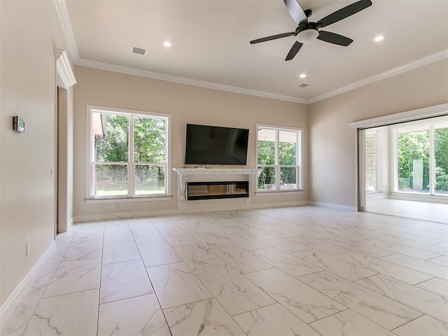 6209 Lakewood Ridge Rd, Edmond, OK 73013 - unfurnished living room with healthy amount of natural light, light marble finish flooring, ceiling fan, recessed lighting, and crown molding