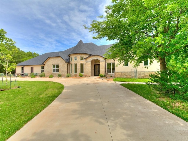 6209 Lakewood Ridge Rd, Edmond, OK 73013 - french country inspired facade with stone siding and concrete driveway