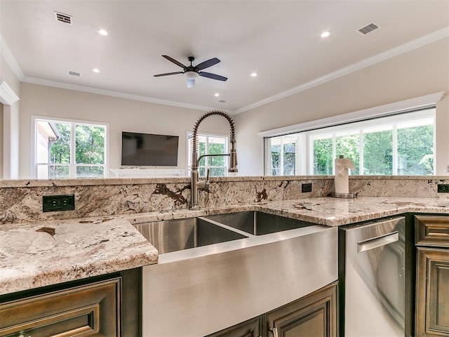 6209 Lakewood Ridge Rd, Edmond, OK 73013 - kitchen with stainless steel dishwasher, healthy amount of natural light, a ceiling fan, recessed lighting, and light stone countertops