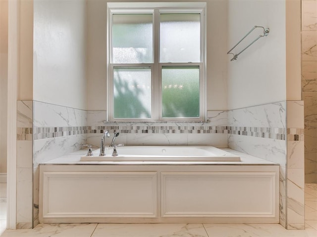 6209 Lakewood Ridge Rd, Edmond, OK 73013 - bathroom with marble finish flooring, a garden tub, wainscoting, and tile walls