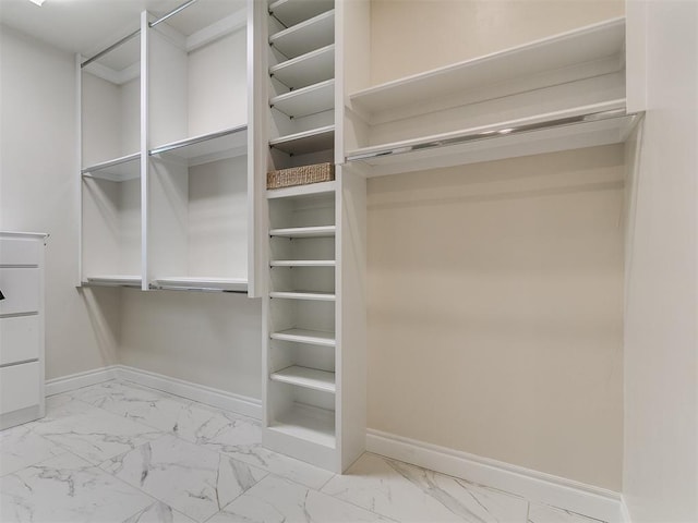 6209 Lakewood Ridge Rd, Edmond, OK 73013 - spacious closet featuring marble finish flooring