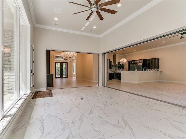 6209 Lakewood Ridge Rd, Edmond, OK 73013 - unfurnished living room with a chandelier, a ceiling fan, marble finish flooring, crown molding, and a towering ceiling