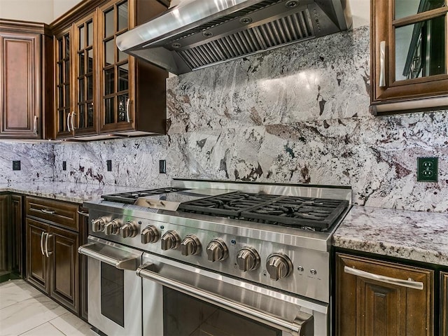 6209 Lakewood Ridge Rd, Edmond, OK 73013 - kitchen with double oven range, exhaust hood, tasteful backsplash, and light stone counters