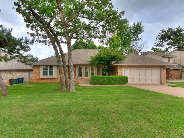 908 Carfax Rd, Edmond, OK 73034 - ranch-style house with a garage, concrete driveway, brick siding, and a front lawn