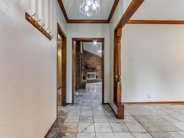 908 Carfax Rd, Edmond, OK 73034 - hallway with crown molding, a chandelier, and a textured ceiling