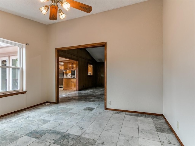 908 Carfax Rd, Edmond, OK 73034 - spare room with a ceiling fan and light marble finish flooring