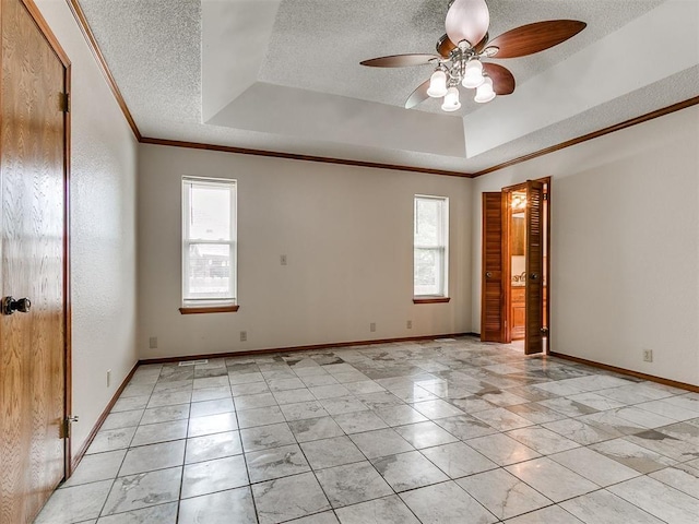 908 Carfax Rd, Edmond, OK 73034 - empty room featuring plenty of natural light, a textured ceiling, ceiling fan, a raised ceiling, and crown molding