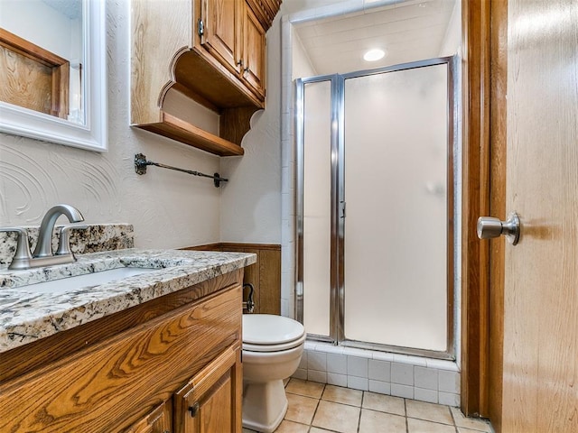908 Carfax Rd, Edmond, OK 73034 - bathroom featuring vanity, a stall shower, and tile patterned floors