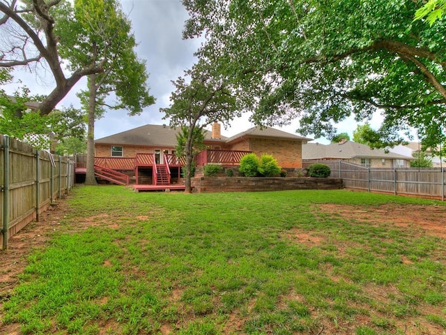 908 Carfax Rd, Edmond, OK 73034 - fenced backyard featuring a wooden deck and stairs