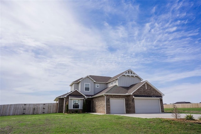 7310 S Brookwater Way, Stillwater, OK 74074 - craftsman-style house featuring fence, brick siding, concrete driveway, a garage, and a front yard
