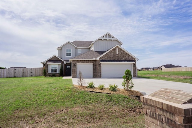 7310 S Brookwater Way, Stillwater, OK 74074 - craftsman inspired home featuring fence, an attached garage, brick siding, concrete driveway, and a front yard