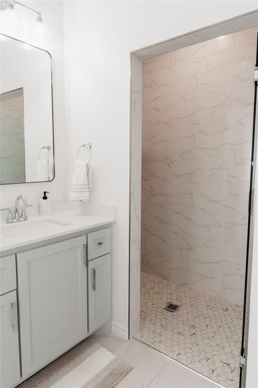 7310 S Brookwater Way, Stillwater, OK 74074 - bathroom with vanity and a marble finish shower