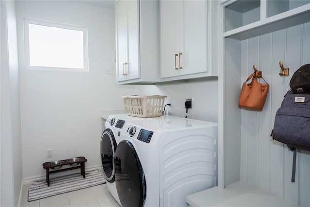 7310 S Brookwater Way, Stillwater, OK 74074 - laundry area featuring baseboards, cabinet space, and washer and clothes dryer