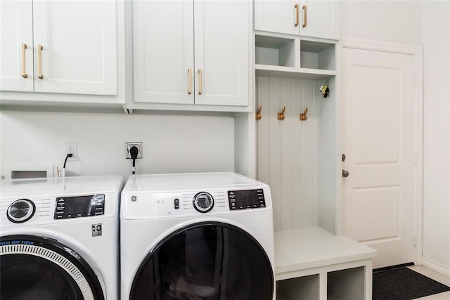 7310 S Brookwater Way, Stillwater, OK 74074 - laundry area with cabinet space and independent washer and dryer