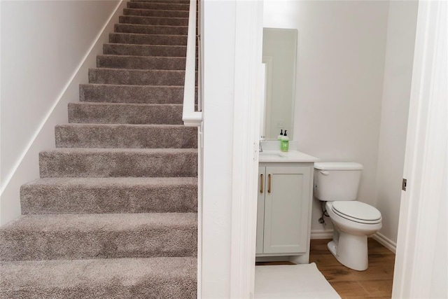 7310 S Brookwater Way, Stillwater, OK 74074 - staircase with baseboards and wood finished floors