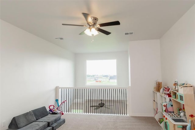 7310 S Brookwater Way, Stillwater, OK 74074 - living area featuring a ceiling fan, visible vents, and carpet floors