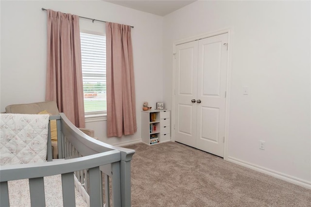 7310 S Brookwater Way, Stillwater, OK 74074 - carpeted bedroom with a closet and baseboards