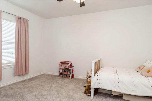 7310 S Brookwater Way, Stillwater, OK 74074 - bedroom featuring baseboards, multiple windows, carpet flooring, and ceiling fan