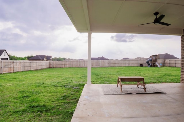 7310 S Brookwater Way, Stillwater, OK 74074 - view of yard with a playground, a patio, ceiling fan, and a fenced backyard