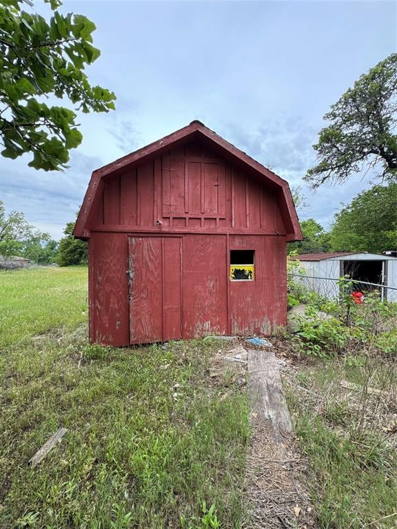 view of shed with fence