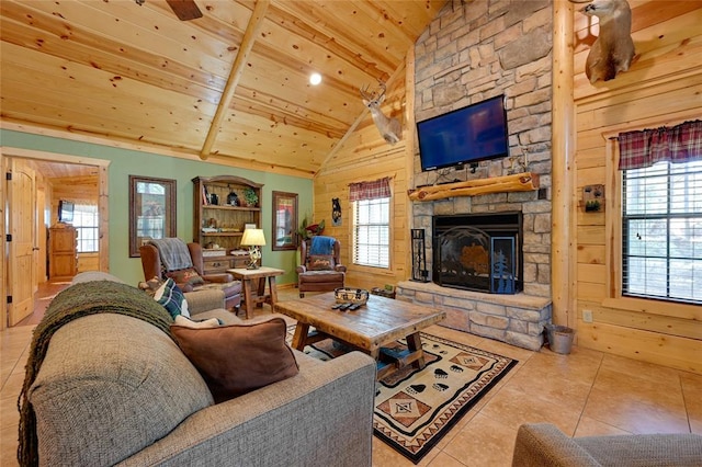 tiled living area featuring wood ceiling, a stone fireplace, wooden walls, recessed lighting, and high vaulted ceiling