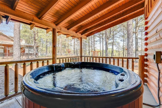 deck with a hot tub
