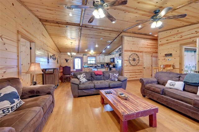 living area with wood ceiling, ceiling fan, wooden walls, light wood finished floors, and a chandelier