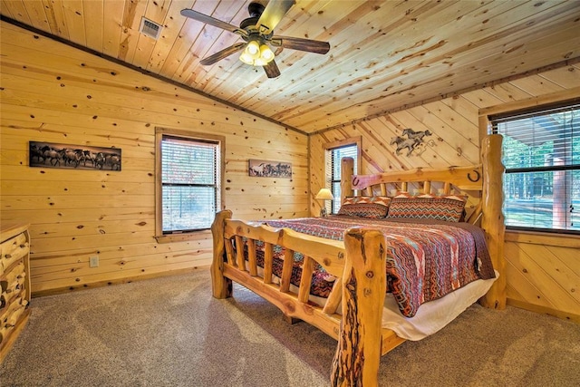 carpeted bedroom with lofted ceiling, wooden ceiling, wooden walls, and ceiling fan
