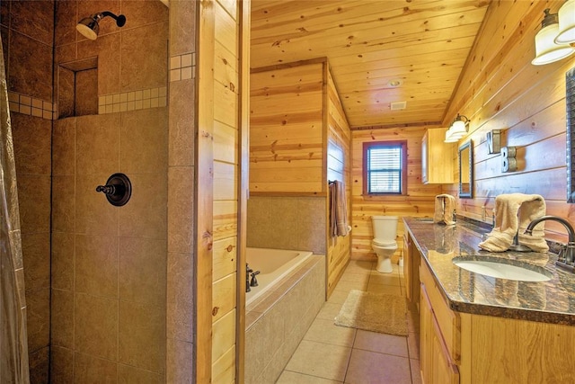 bathroom with a tile shower, tile patterned flooring, vanity, wood ceiling, and toilet