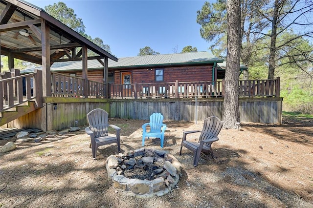 view of yard with a fire pit and a deck
