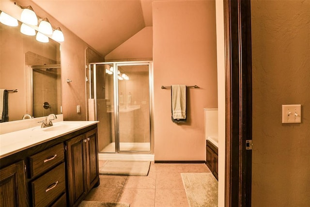 bathroom with vanity, tile patterned flooring, and a stall shower