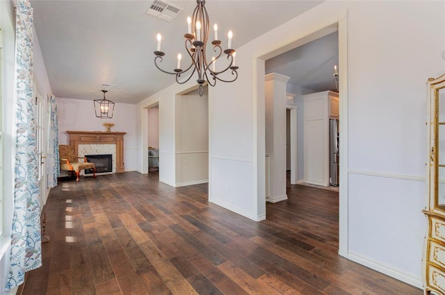 13403 NE 225th St, Fletcher, OK 73541 - unfurnished dining area featuring dark wood finished floors, a chandelier, a fireplace, and baseboards