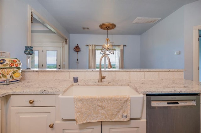 13403 NE 225th St, Fletcher, OK 73541 - kitchen with dishwasher, a sink, a chandelier, light stone counters, and decorative light fixtures