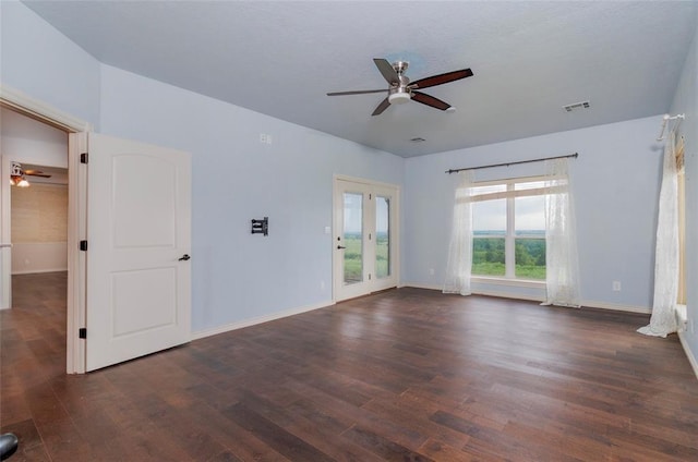 13403 NE 225th St, Fletcher, OK 73541 - empty room featuring a ceiling fan, dark wood-style floors, and baseboards