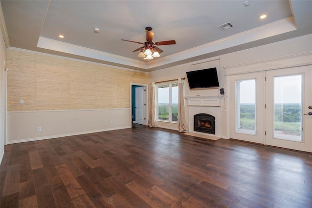 13403 NE 225th St, Fletcher, OK 73541 - unfurnished living room with a tray ceiling, ornamental molding, ceiling fan, a fireplace with flush hearth, and wood finished floors