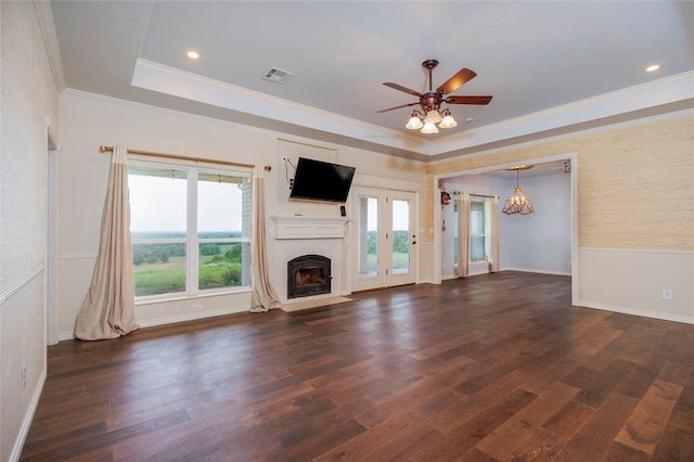 13403 NE 225th St, Fletcher, OK 73541 - unfurnished living room with ornamental molding, healthy amount of natural light, a fireplace with flush hearth, a raised ceiling, and dark wood-style floors