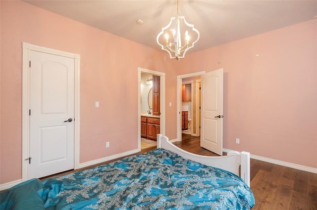 13403 NE 225th St, Fletcher, OK 73541 - bedroom featuring a chandelier, wood finished floors, baseboards, and ensuite bath
