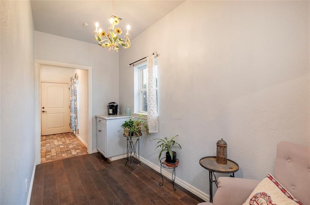 13403 NE 225th St, Fletcher, OK 73541 - hallway featuring a chandelier, dark wood-style flooring, and baseboards