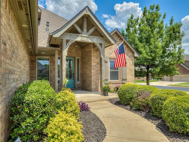 8509 NW 125th St, Oklahoma City, OK 73142 - entrance to property featuring brick siding and a shingled roof